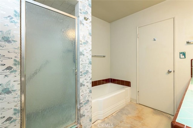 bathroom featuring tile patterned flooring and independent shower and bath