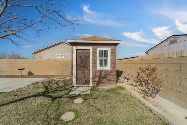 view of outbuilding with a lawn