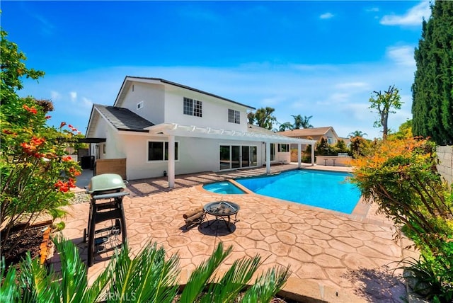 view of swimming pool featuring a fenced in pool, a grill, a patio area, an outdoor fire pit, and fence