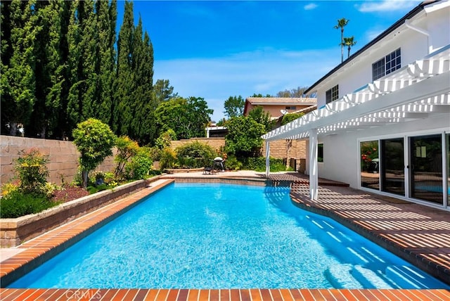 view of pool with a patio area, a fenced backyard, a fenced in pool, and a pergola