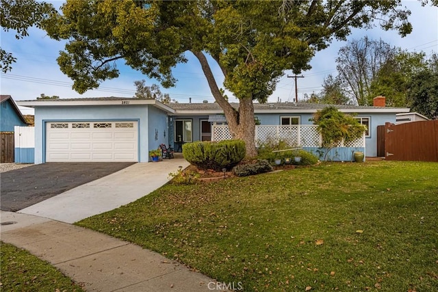 single story home featuring a front yard and a garage