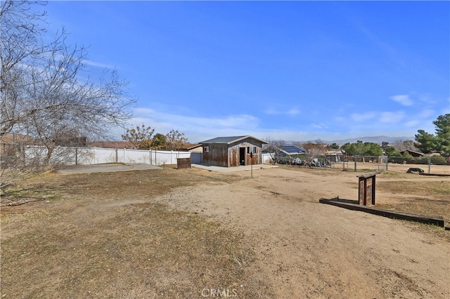 view of yard featuring an outbuilding and a mountain view