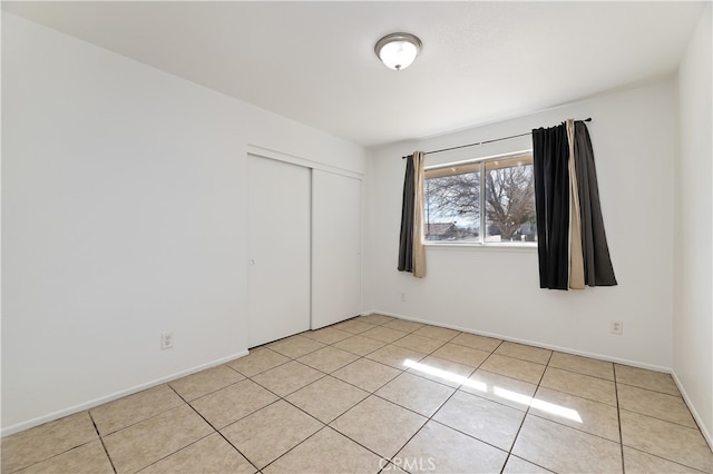 unfurnished room with light tile patterned floors