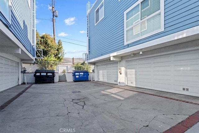 exterior space with a garage and fence