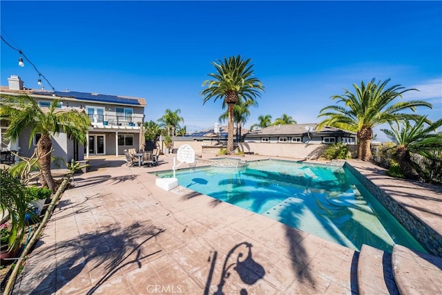 view of pool featuring a patio area and a pool with connected hot tub