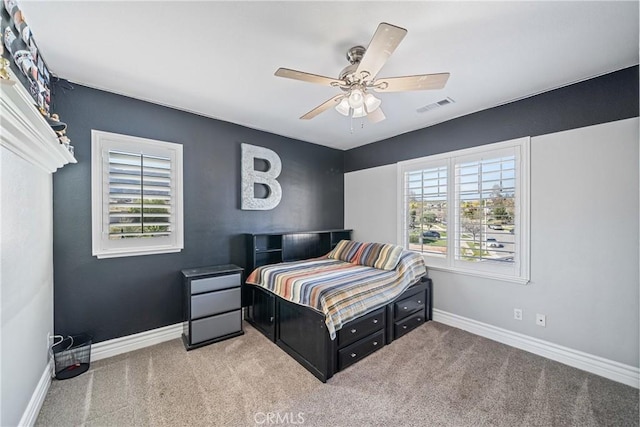 bedroom with carpet, visible vents, ceiling fan, and baseboards