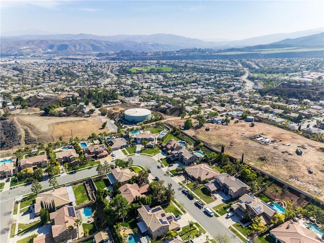 drone / aerial view featuring a residential view and a mountain view