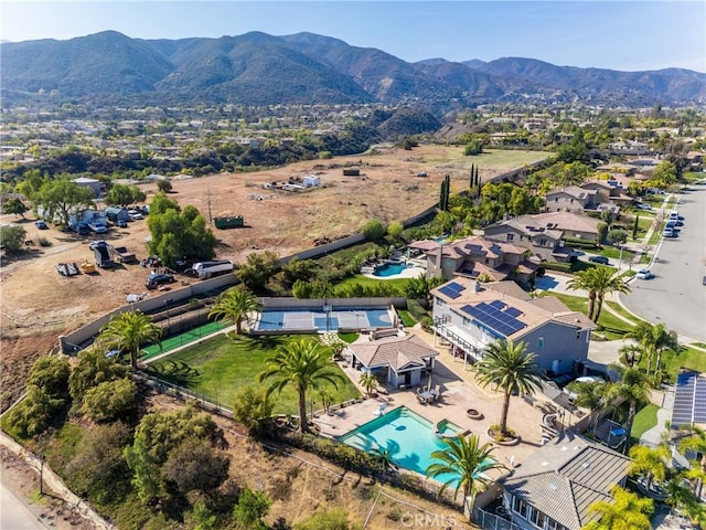 drone / aerial view featuring a residential view and a mountain view