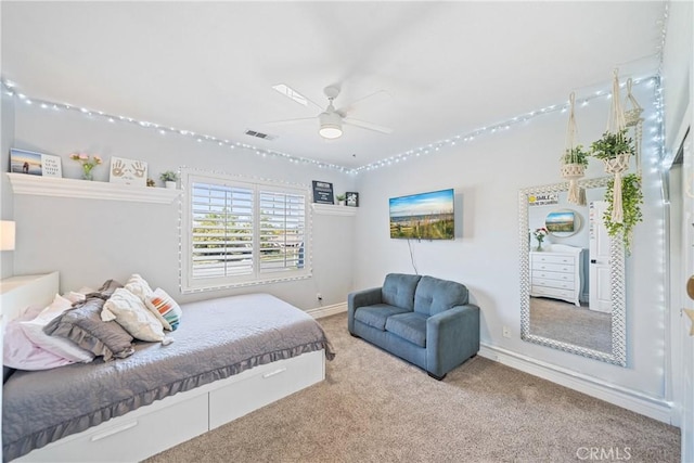 bedroom with carpet floors, baseboards, visible vents, and a ceiling fan