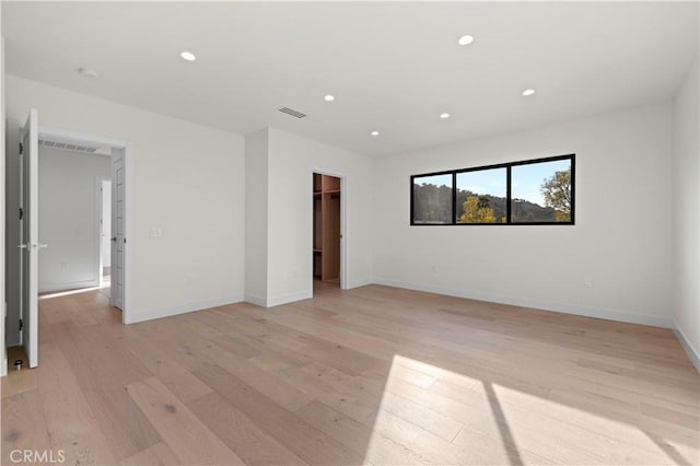 empty room with light wood-type flooring