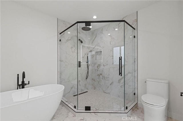 bathroom featuring separate shower and tub and toilet