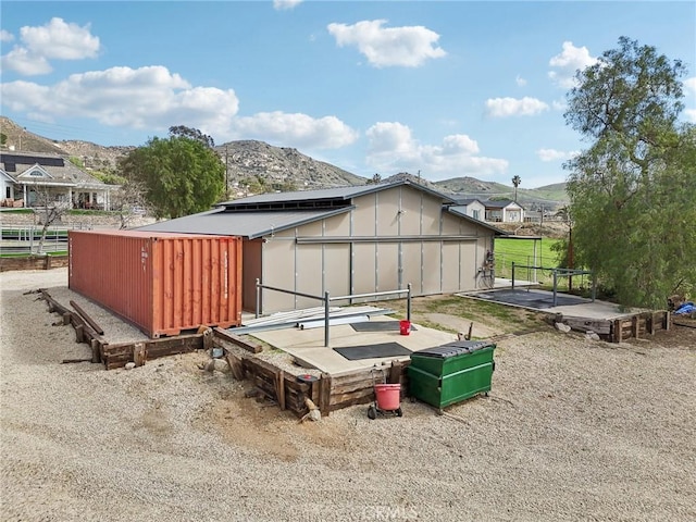 4210 Crestview Dr, Norco, CA 92860 - view of outdoor structure with solar panels and a mountain view
