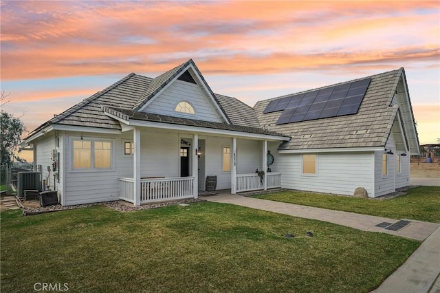 4210 Crestview Dr, Norco, CA 92860 - view of front facade with covered porch, roof mounted solar panels, and a front yard