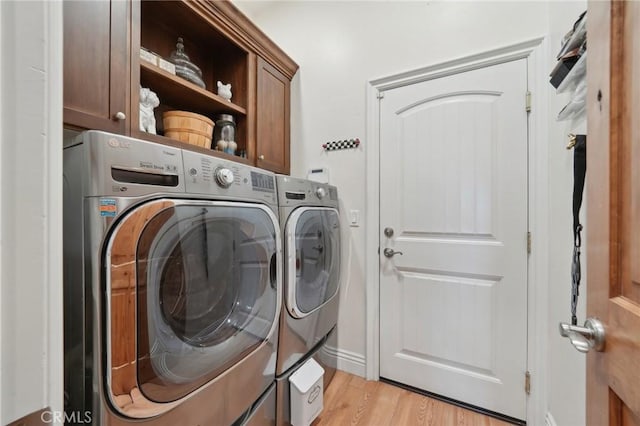 4210 Crestview Dr, Norco, CA 92860 - laundry room featuring cabinet space, washer and dryer, and light wood-style floors