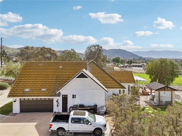 4210 Crestview Dr, Norco, CA 92860 - view of front of home featuring a mountain view, a garage, and driveway