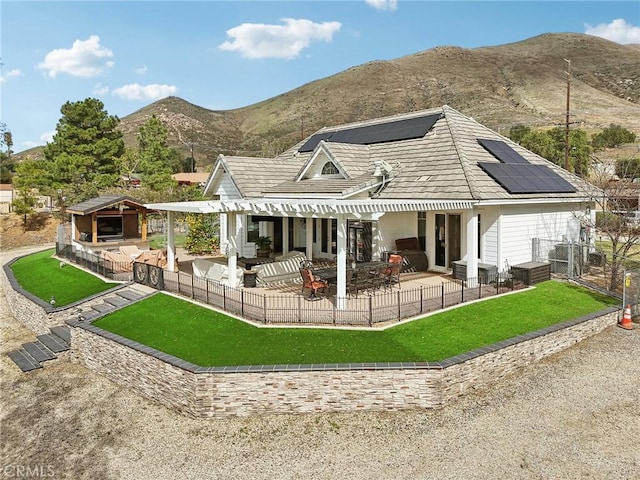 4210 Crestview Dr, Norco, CA 92860 - back of property with roof mounted solar panels, a patio, a mountain view, an outdoor living space, and a pergola