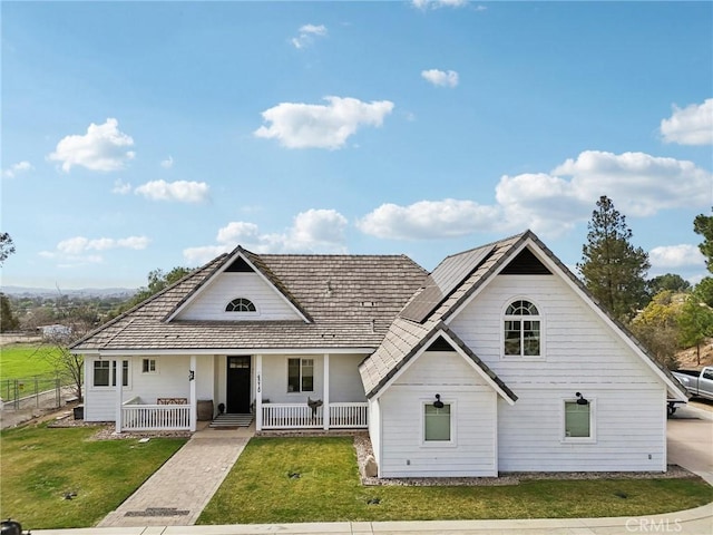 4210 Crestview Dr, Norco, CA 92860 - view of front of property featuring a porch, solar panels, and a front yard
