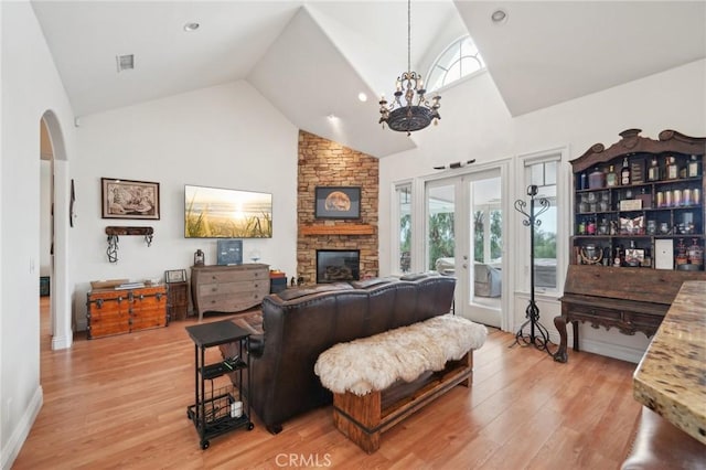 4210 Crestview Dr, Norco, CA 92860 - living area with high vaulted ceiling, arched walkways, plenty of natural light, and light wood-style flooring