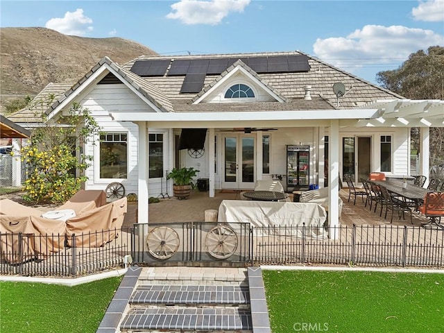 4210 Crestview Dr, Norco, CA 92860 - rear view of house with french doors, solar panels, a patio, outdoor dining space, and outdoor lounge area