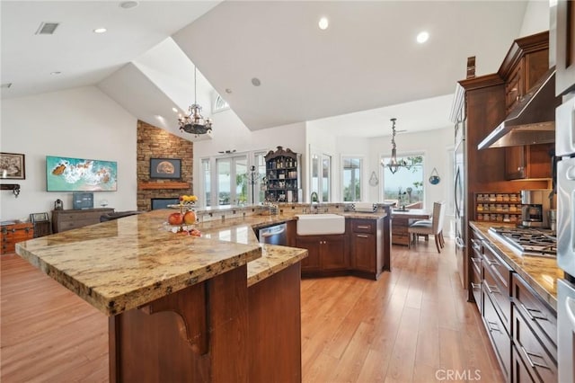 4210 Crestview Dr, Norco, CA 92860 - kitchen featuring a chandelier, under cabinet range hood, healthy amount of natural light, a large island, and recessed lighting