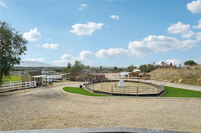4210 Crestview Dr, Norco, CA 92860 - surrounding community with an outdoor structure, a mountain view, and a riding arena