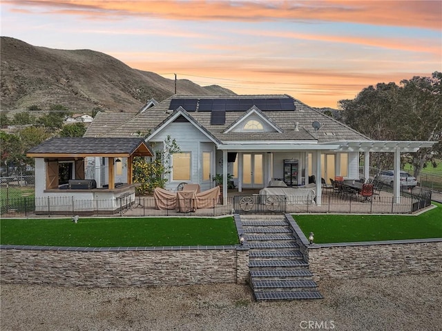 4210 Crestview Dr, Norco, CA 92860 - rear view of house featuring a patio area, french doors, solar panels, a pergola, and a mountain view