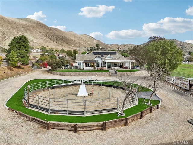 4210 Crestview Dr, Norco, CA 92860 - view of property's community with a mountain view, curved driveway, and a horse riding arena