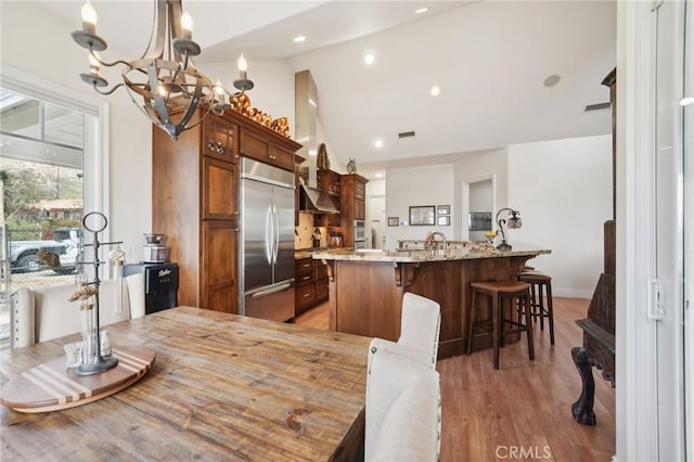 4210 Crestview Dr, Norco, CA 92860 - dining space with lofted ceiling, a chandelier, and light wood finished floors