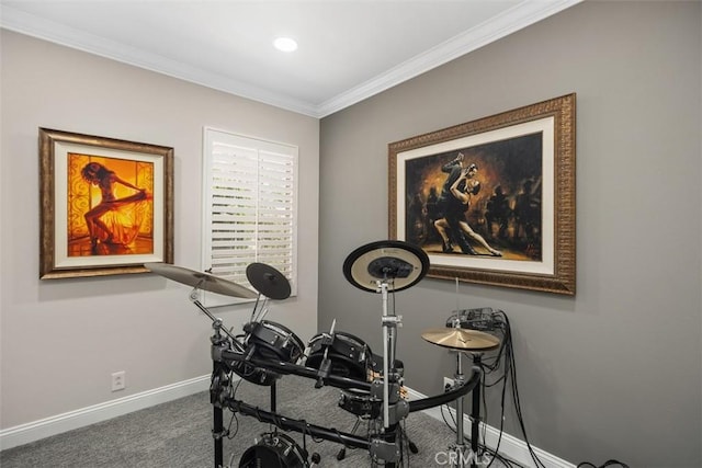 exercise room featuring carpet floors, baseboards, and ornamental molding