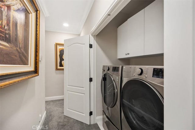 washroom with separate washer and dryer, dark carpet, cabinet space, and baseboards