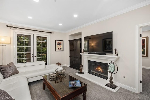 living room featuring carpet floors, french doors, ornamental molding, a glass covered fireplace, and baseboards