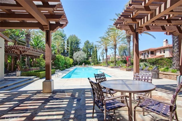 community pool featuring a patio and a pergola