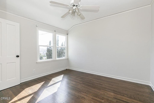 unfurnished room featuring dark wood-style floors, ceiling fan, baseboards, and vaulted ceiling