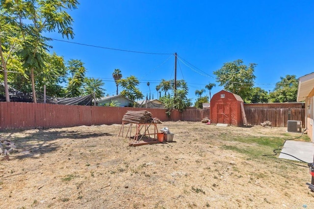 view of yard with a storage unit and central AC