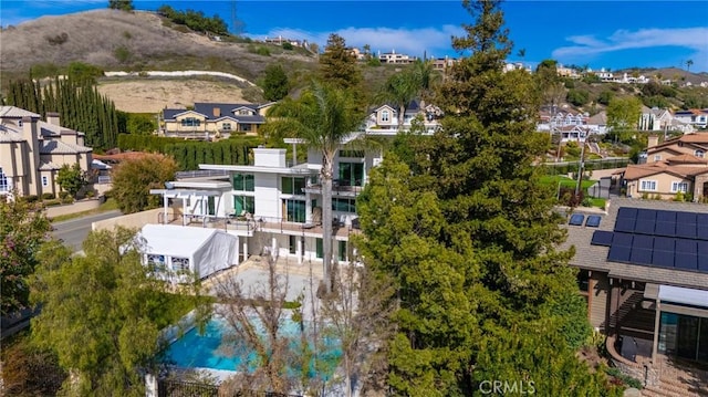 birds eye view of property with a residential view