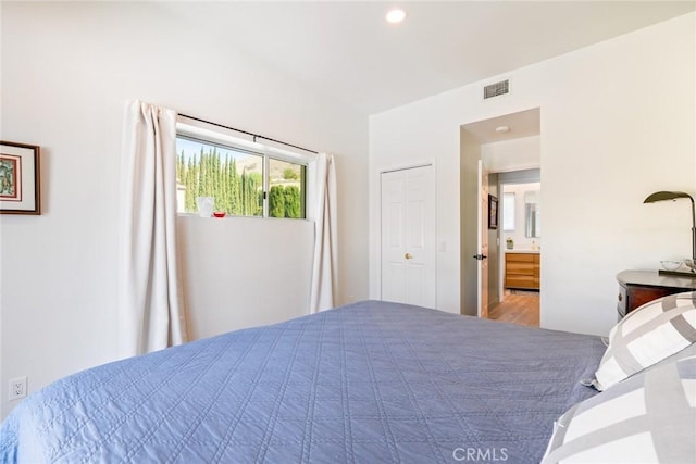 bedroom featuring visible vents