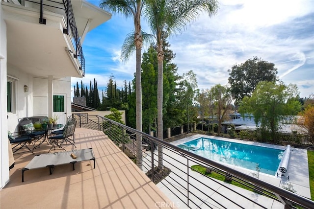 view of pool with a fenced in pool