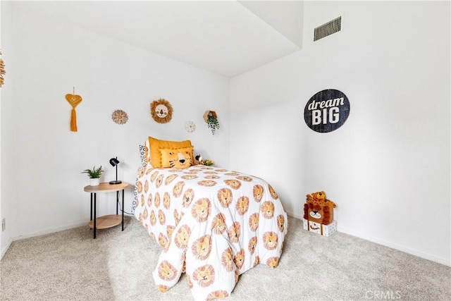 bedroom with visible vents and carpet flooring