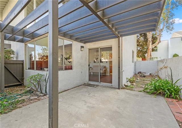 view of patio / terrace featuring fence