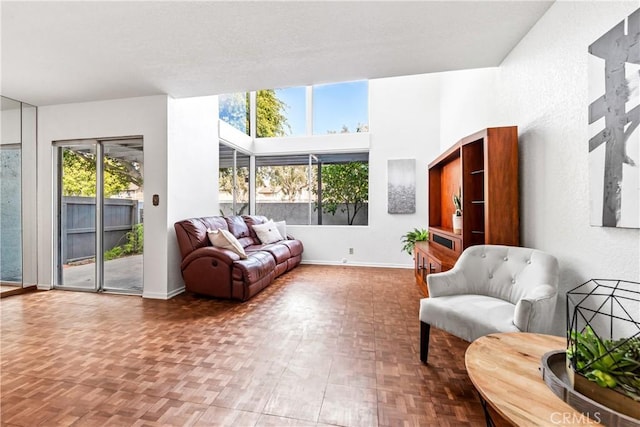 interior space with a wealth of natural light and baseboards