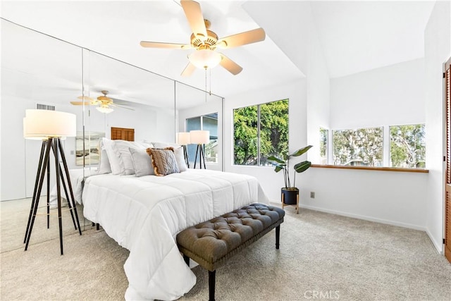 carpeted bedroom featuring visible vents, baseboards, and ceiling fan