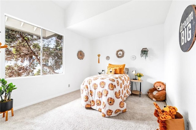 bedroom featuring carpet flooring and baseboards