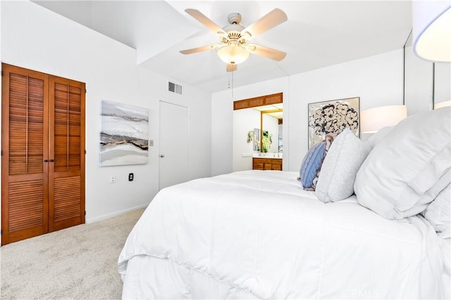 carpeted bedroom featuring visible vents and a ceiling fan