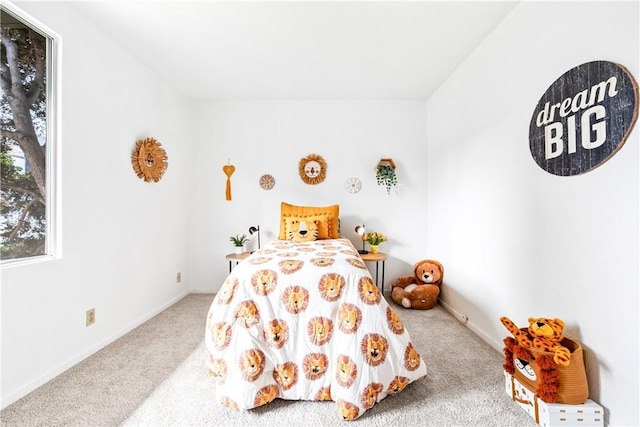 carpeted bedroom with baseboards