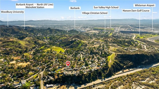 drone / aerial view featuring a mountain view