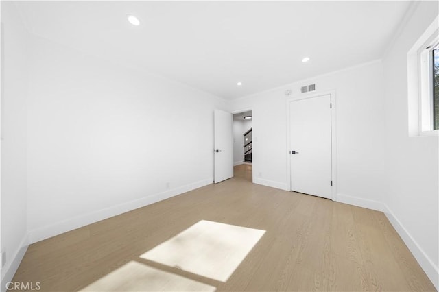 unfurnished bedroom with light wood-type flooring