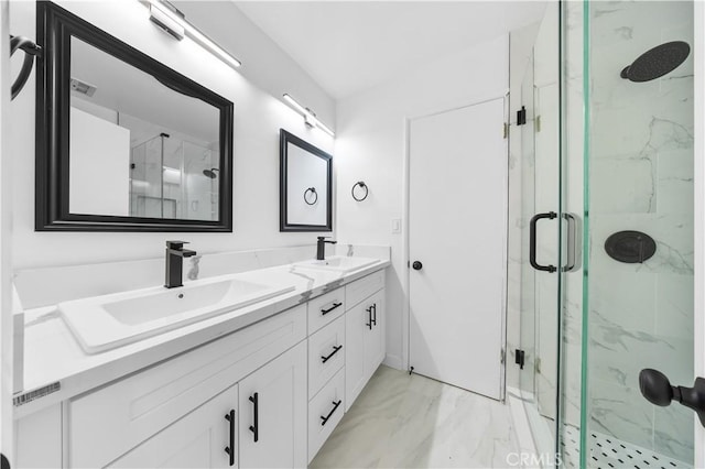 bathroom featuring an enclosed shower and vanity