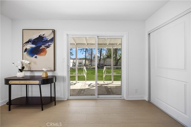 doorway to outside with hardwood / wood-style floors