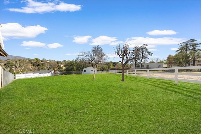 view of yard with a rural view