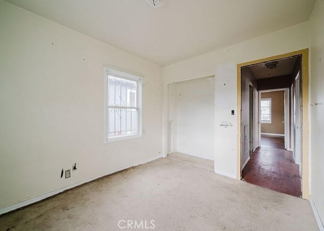 empty room with light colored carpet
